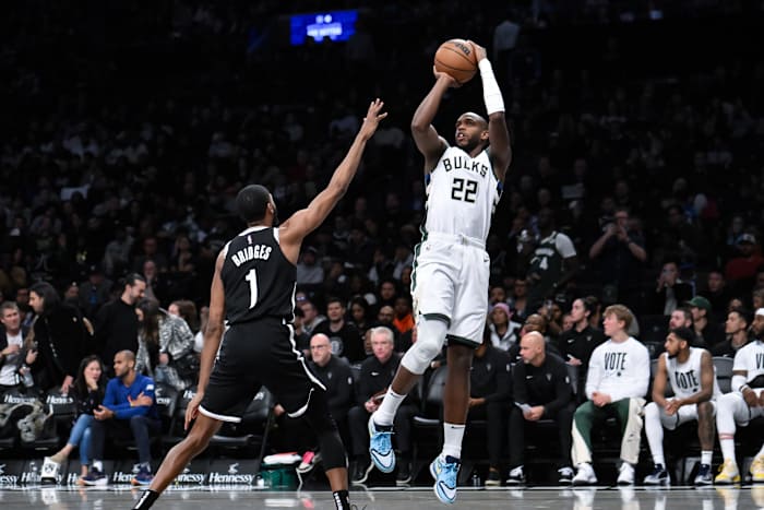 Milwaukee Bucks forward Khris Middleton (22) shoots the ball against Brooklyn Nets forward Mikal Bridges (1) d